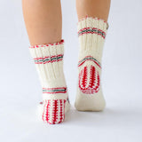 white wool sock with red and green details and pattern, handknitten, vegan and fairtrade wool sock Christmas edition for women back view