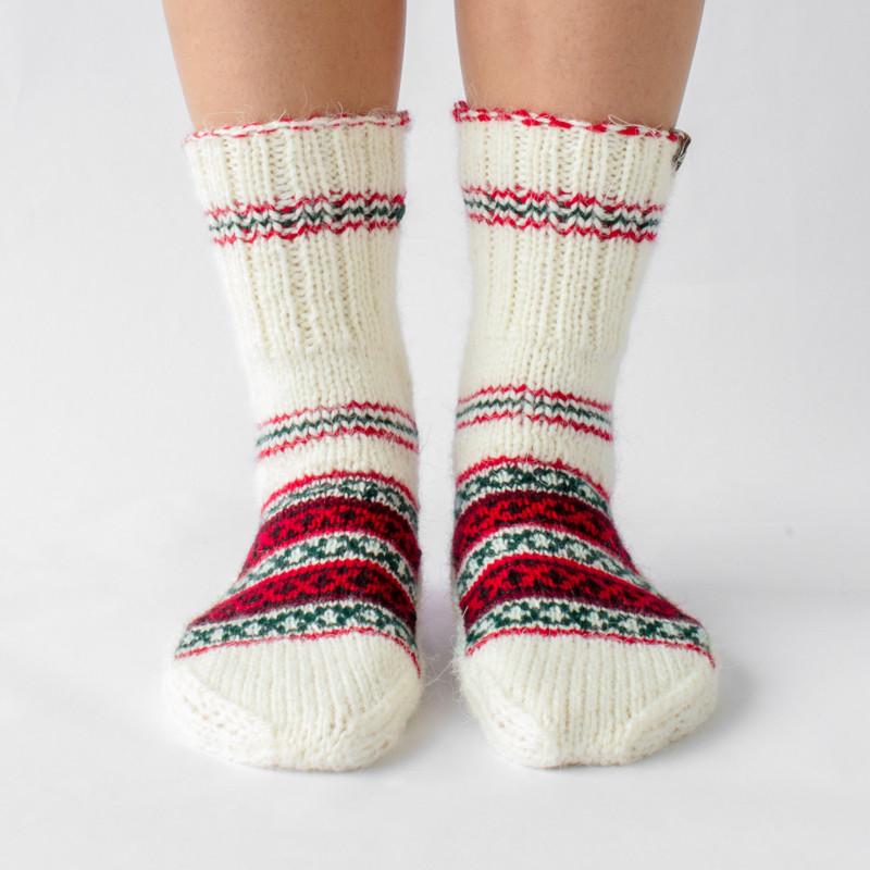 white wool sock with red and green details and pattern, handknitten, vegan and fairtrade wool sock Christmas edition for women front view